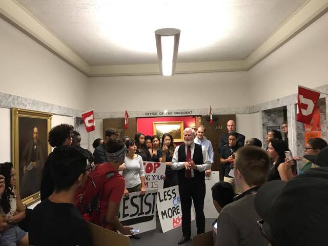 Students protest outside of President David Pershing's office as they call on administration to cancel a Ben Shapiro speaking event