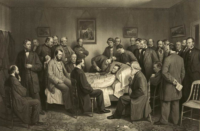 Abraham Lincoln is cared by doctors at the Peterson house