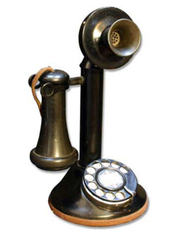 Candle-stick rotary dial phone.