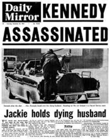 John F. Kennedy is assassinated in Dallas, Texas.
