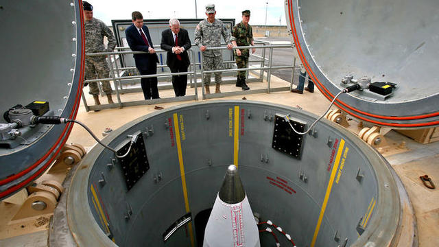 President Bill Clinton signs the National Missile Defense Act