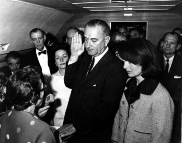 Lyndon B. Johnson is sworn in.