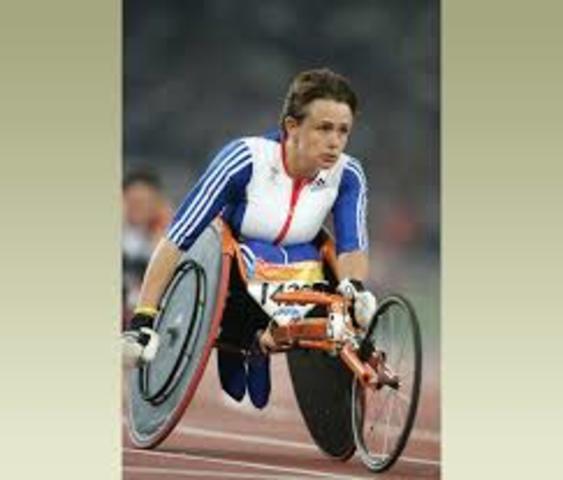 People in wheelchairs compete