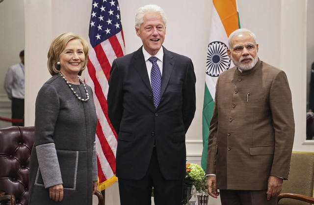US President Bill Clinton makes a groundbreaking visit to improve ties