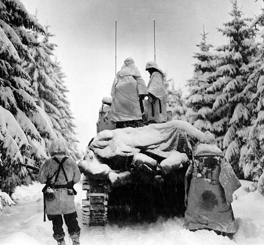 Battle of the Bulge, the last German offensive, begins in a frigid northern European winter