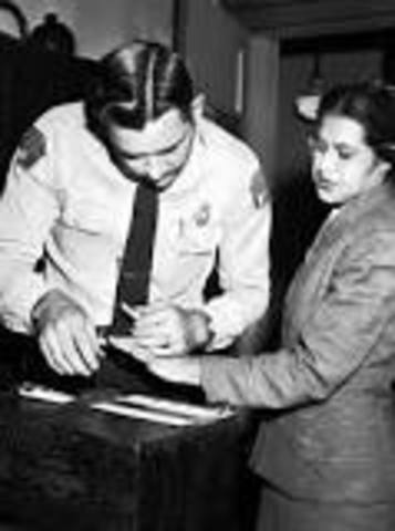 Rosa Parks refuses to give up her seat