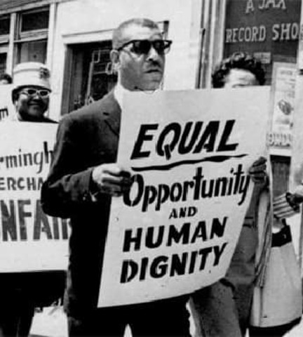 1964 - The Civil Rights Act becomes law. It prohibits discrimination based on race, color, sex, religion or national origin.