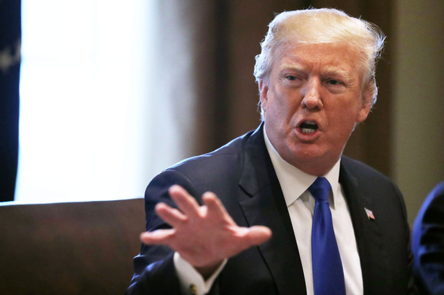 President Donald Trump signs the Tax Cuts and Jobs Act