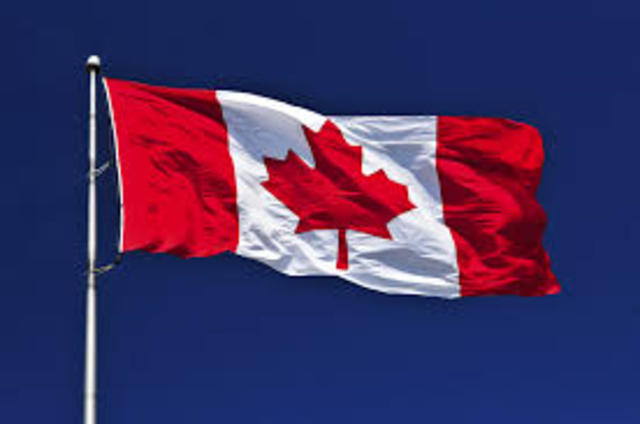 Canada adopts the maple leaf flag-