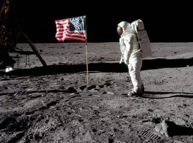 Neil Armstrong walks on the moon