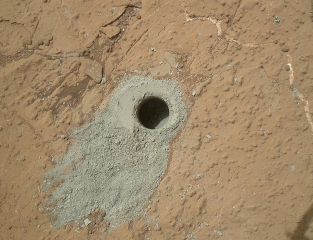Circular hole drilled in rock target, "Cumberland" by Curiosity