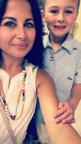 Me and my mommy took a picture at the school awards ceremony