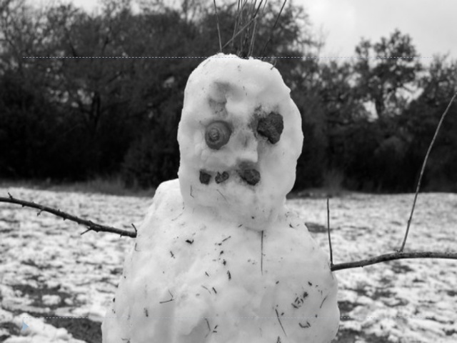 Jem turns their snowman into a caricature of Mr. Avery.