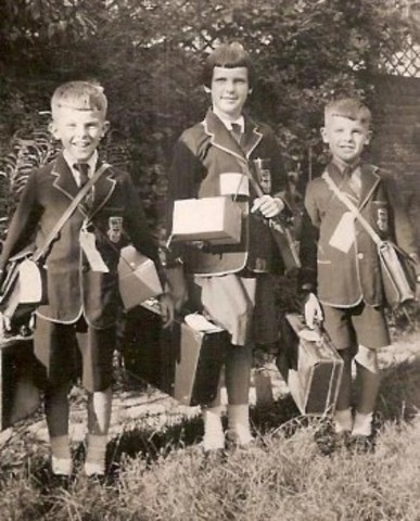 children dressed up with there gas mask.