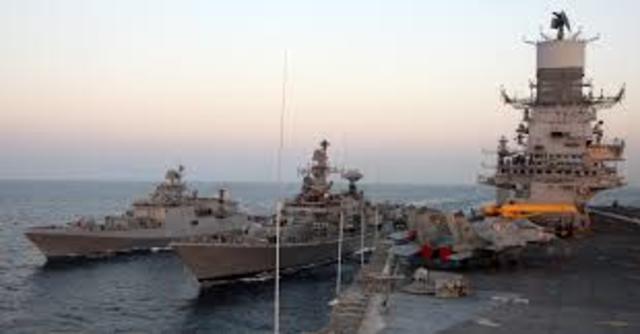 Bringing superior naval forces to make demands