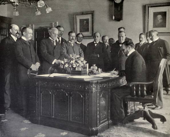 Post Spanish American War, the treaty of Paris is signed which result in Spain and the U.S. acquiring control over Cuba, Puerto Rico, Guam and the Philippines.
