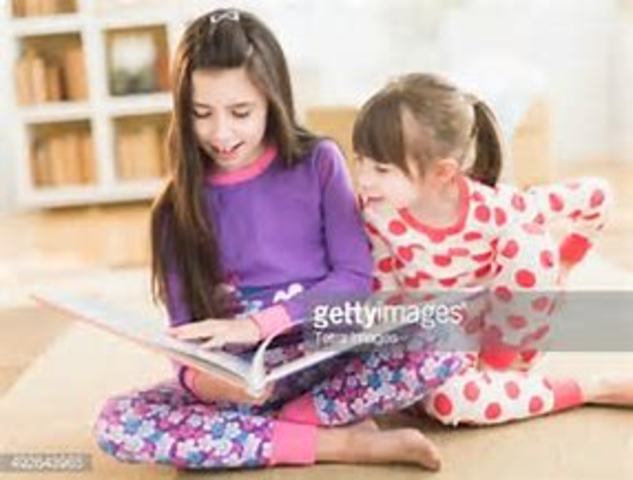 Reading to my older sister