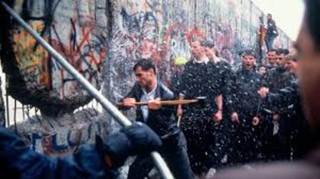 Berlin Wall is torn down, a year later Germany is reunified