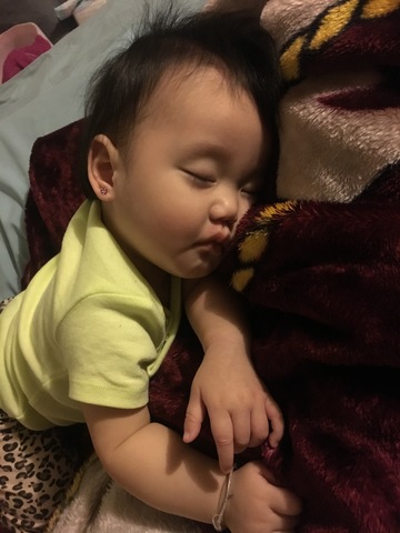 Grace being breastfed by her mother