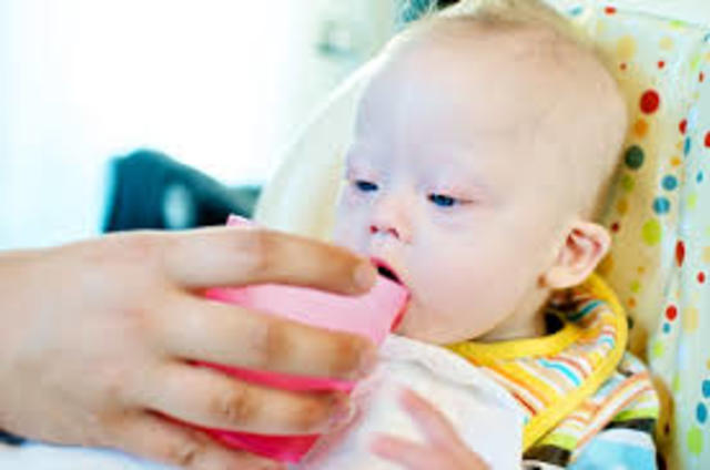 Baby is able to drink from cup