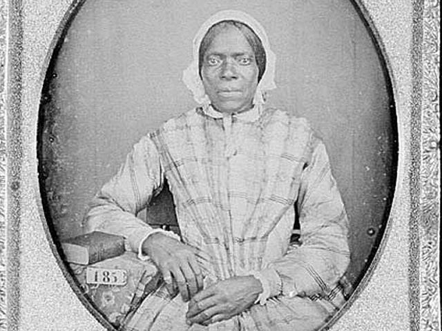 A woman slave in Georgia wearing gown and cap