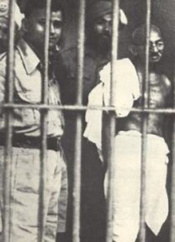 Gandhi is arrested and sentenced to two months in prison for burning his registration card