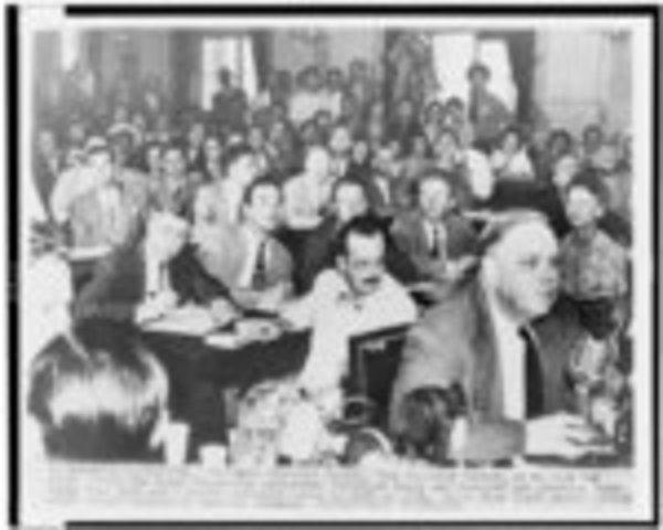 Alger Hiss and Whittaker Chambers appear in a public hearing with television.