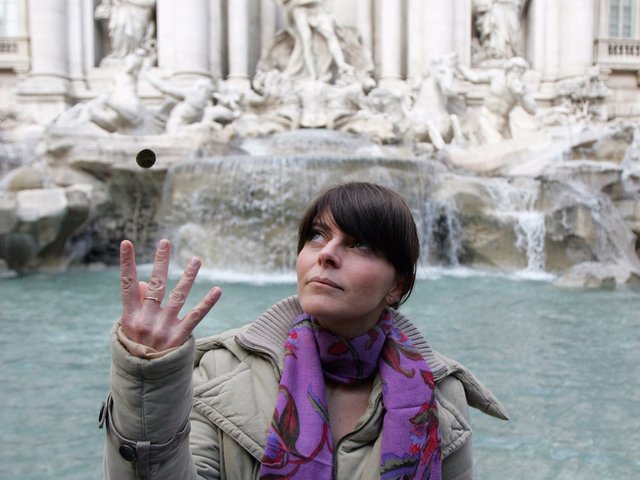 I toss a coin to a fountain