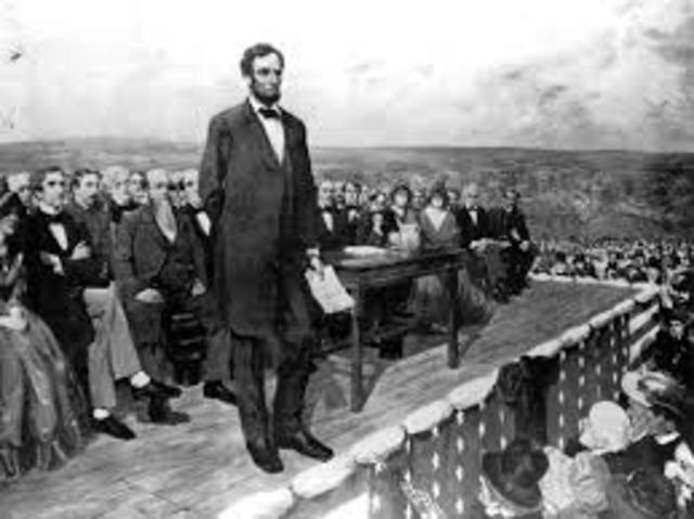 President Abraham Lincoln travels to Gettysburg, which he dedicates as a military cemetery.