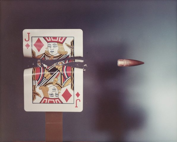 Jack of Diamonds playing card hit by a .30 calibre bullet