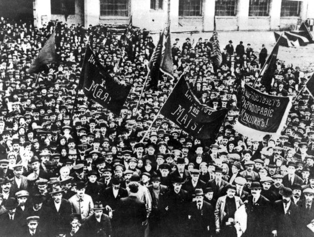 The February Revolution begins with strikes, demonstrations, and mutinies in Petrograd