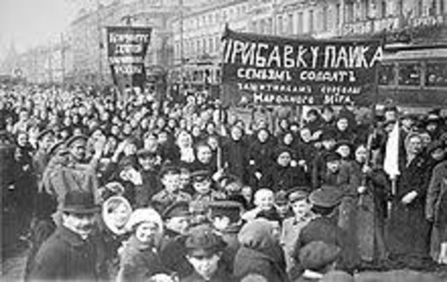 The February Revolution begins with strikes, demonstrations, and mutinies in Petrograd