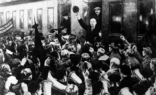 Lenin returns from exile and arrives in Petrograd via a sealed train