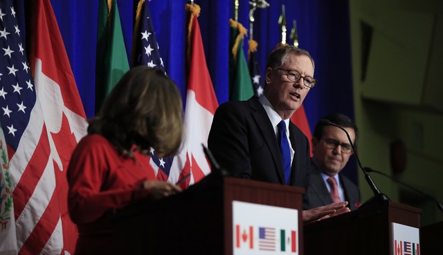 The Auto Pact, forerunner of NAFTA, is signed between United States and Canada