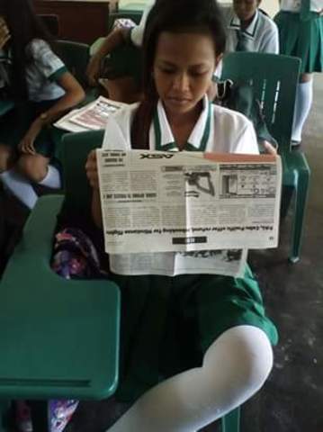Reading Newspaper