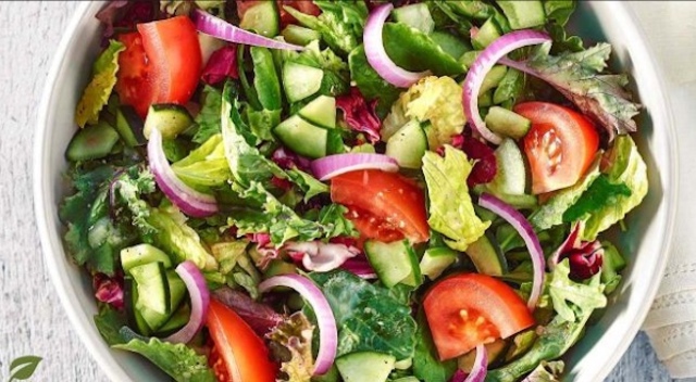 Students enjoy their hard work with a tasty salad