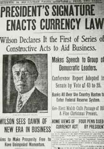 The Federal Reserve Act sets up a new system of federal banks.