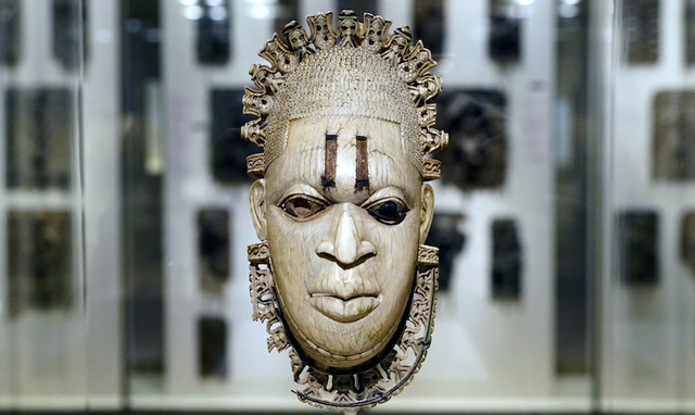 Hip Pendant Representing an Iyoba. c. 1550 CE. Era: African. Medium: Ivory and copper. Size: 23.4 cm.