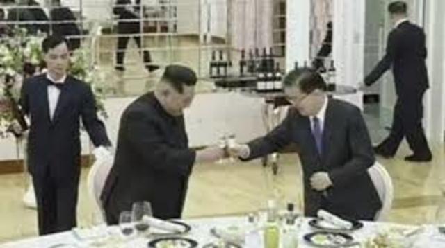 North Korean leader Kim Jong-un meets South Korean officials for the first time since taking office, hosting a dinner in Pyongyang