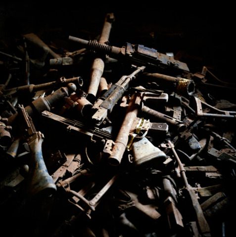 Americans and French lined up in two columns and British walked through them and threw weapons into a big pile