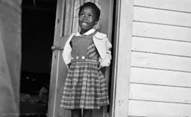 First grader Ruby Bridges is the first African American to attend William Frantz Elementary School in New Orleans. She becomes a class of one as parents remove all Caucasian students from the school.