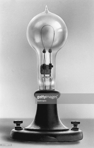 Edison perfects incandescent light bulb