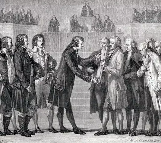 King Louis XVI formally signs the new constitution.