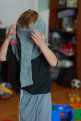 Toddler can dress and undress self (With loose fitting clothing)