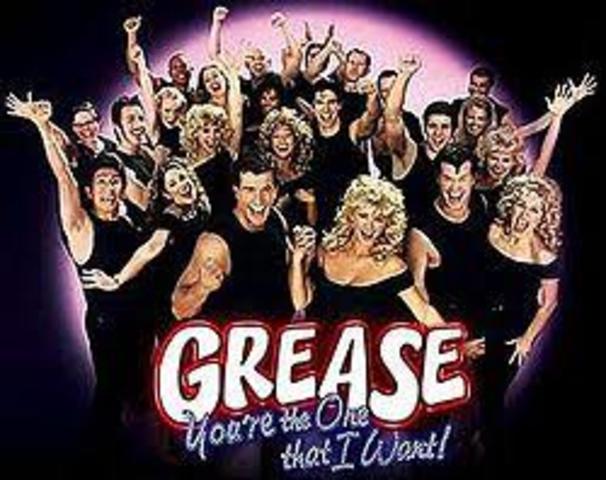 The musical Grease opens on Broadway