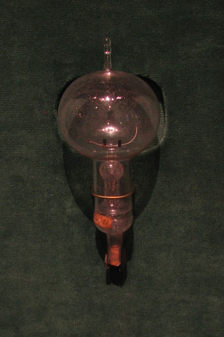 Thomas Edison exhibits incandescent lightbulb