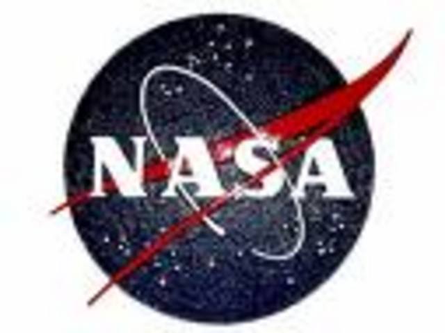 President Eisenhower signs the bill creating NASA.