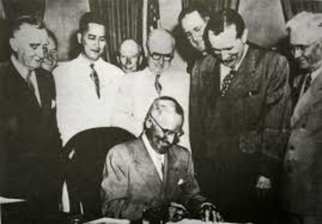 President Truman signs the Organic Act of Guam.