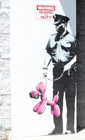 Security Guard With Pink Balloon Dog