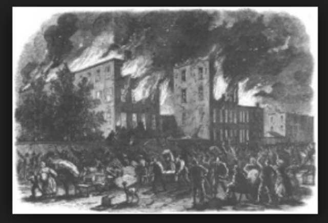 Abraham Lincoln signs emancipation proclimation.